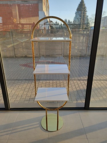 Złoty owalny stojak z półkami a.jpg