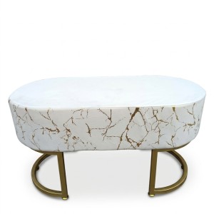 upholstered pouf in an ecru and gold marbled pattern